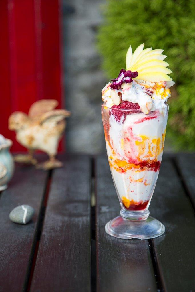 Ice-cream Sundae with fruit and sauces